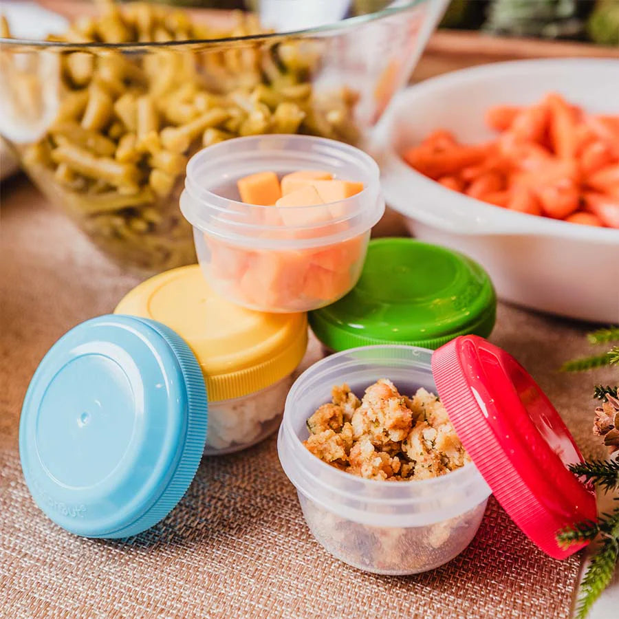 Plastic storage jars hold food on counter