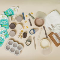 Baby starter products on a beige background.