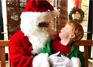 Child sitting on Santa's lap