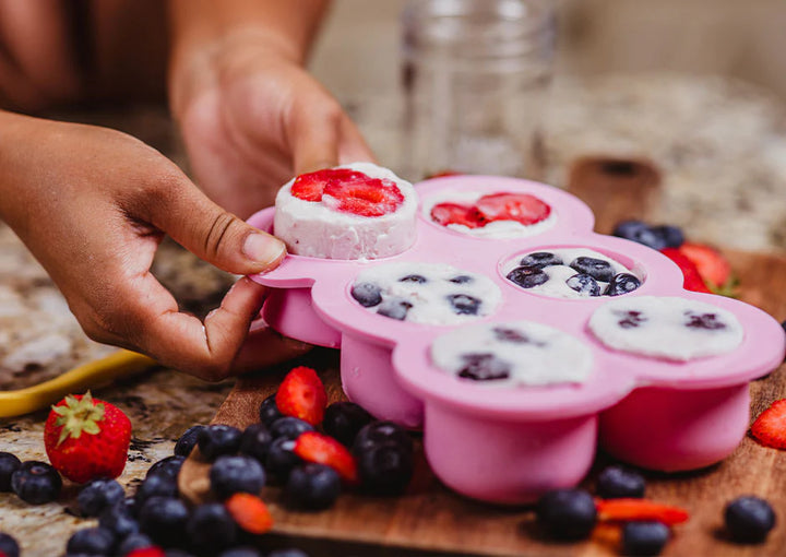 Smoothie with fruit in silicone freezer mold in kitchen